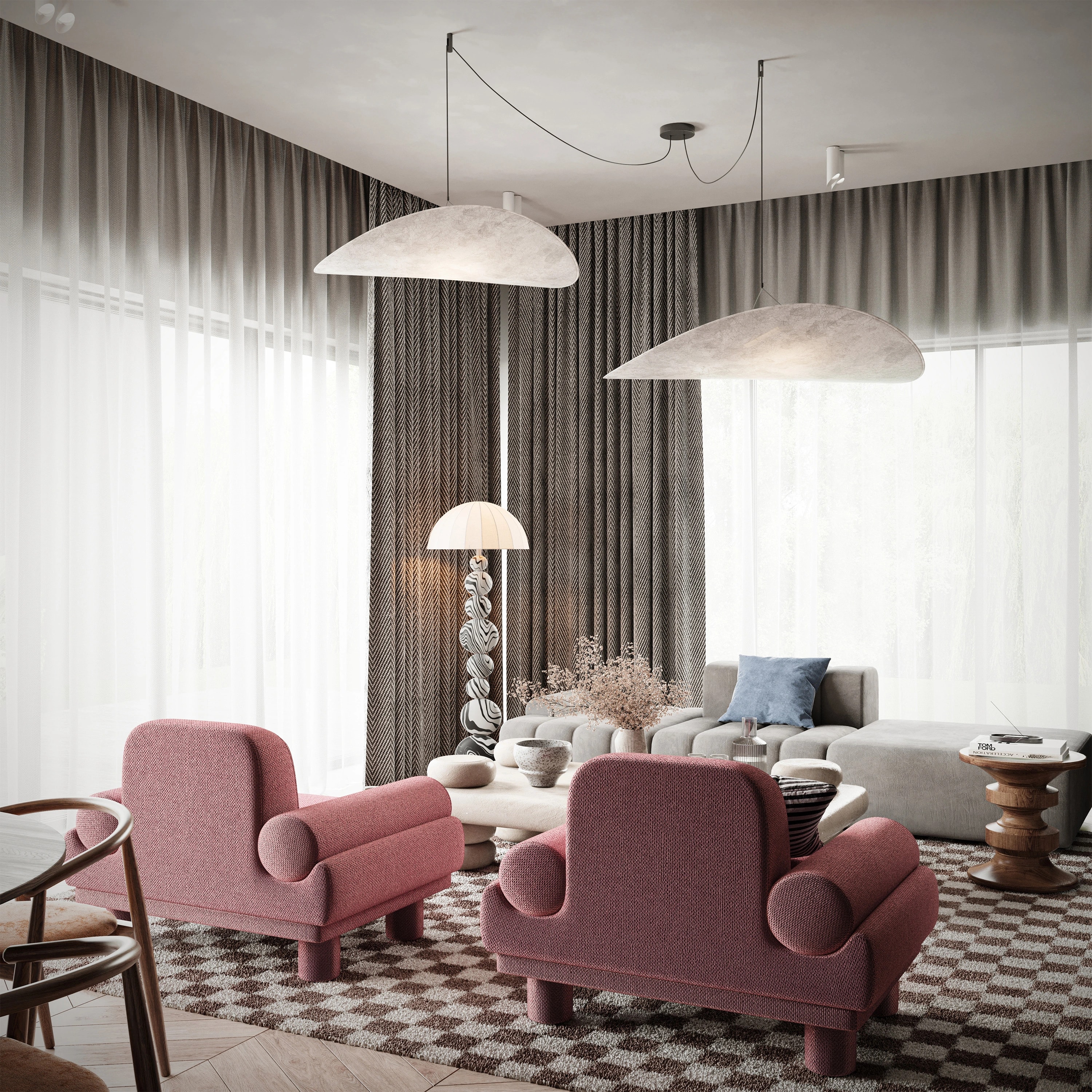 Widok na salon z różowymi fotelami